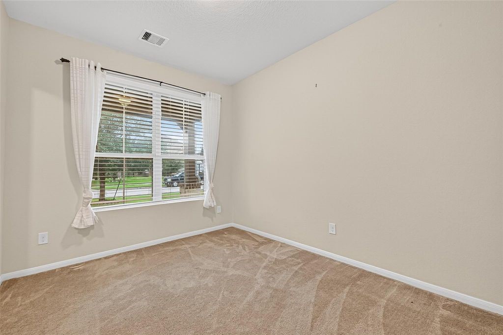 3218 Dappled Vale Trail Spring, TX 77373 - Photo 6 of 47 a view of an empty room with a window