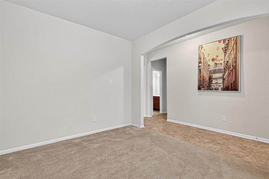 3218 Dappled Vale Trail Spring, TX 77373 - Photo 8 of 47 a view of an empty room with painting on the wall