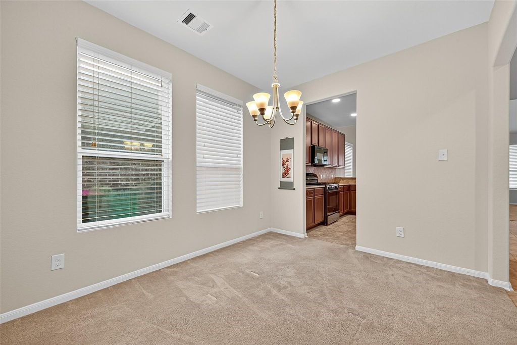 3218 Dappled Vale Trail Spring, TX 77373 - Photo 9 of 47 a view of a kitchen with a sink and dishwasher