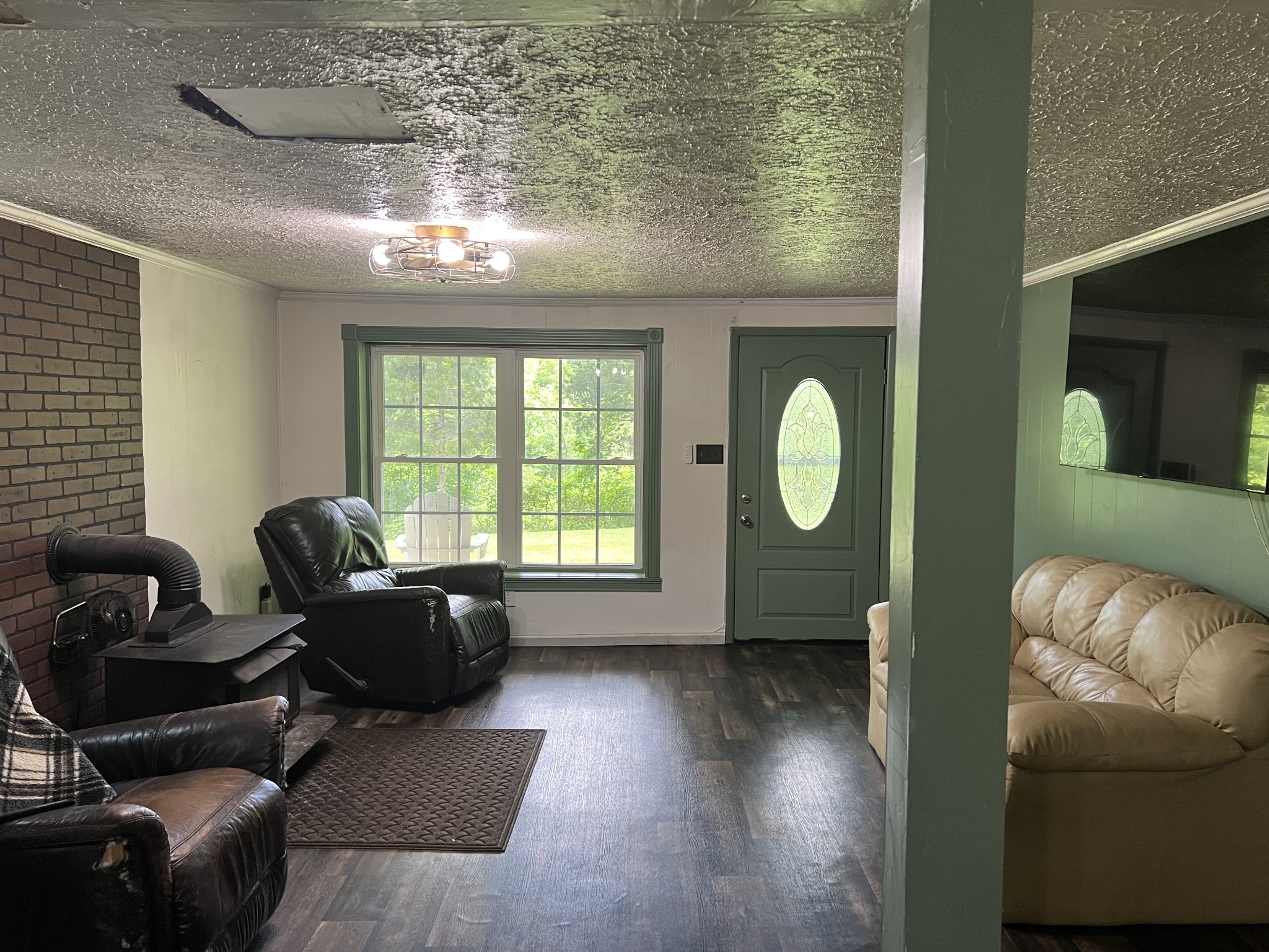651 Allen Chapel Road Hilham, TN 38568 - Photo 25 of 48 a living room with furniture and a window