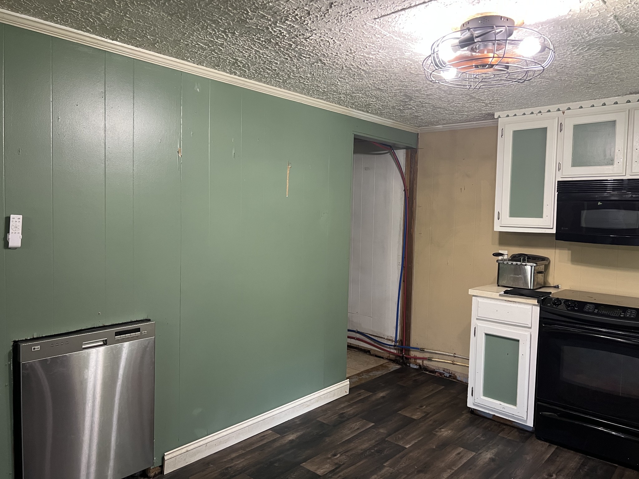 651 Allen Chapel Road Hilham, TN 38568 - Photo 27 of 48 a kitchen with a refrigerator and a stove top oven