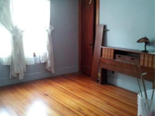 30 Rimmon Avenue Chicopee, MA 01013 - Photo 9 of 12 a view of an empty room with a fireplace