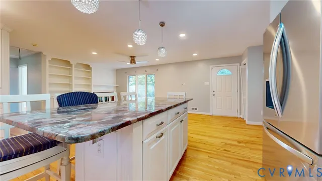 a kitchen with stainless steel appliances granite countertop a sink and cabinets