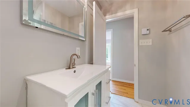 a bathroom with a sink and a mirror