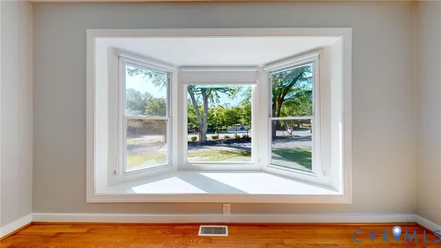 a view of a bathtub in front of a room
