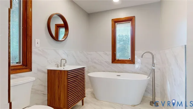 a bathroom with a bathtub and a sink
