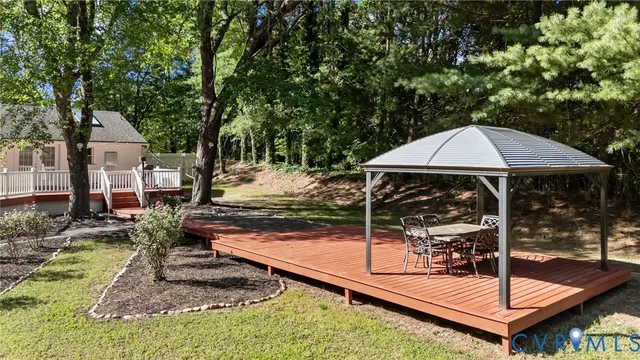 a view of a backyard with sitting area