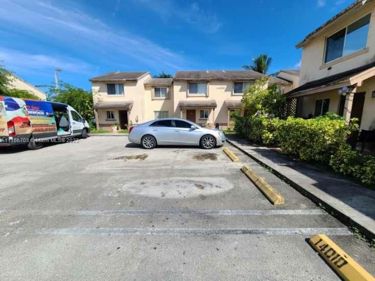 14010 Northeast 3rd Court, Unit 1 Miami, FL 33161 - Photo 1 of 6 a car parked in front of a building