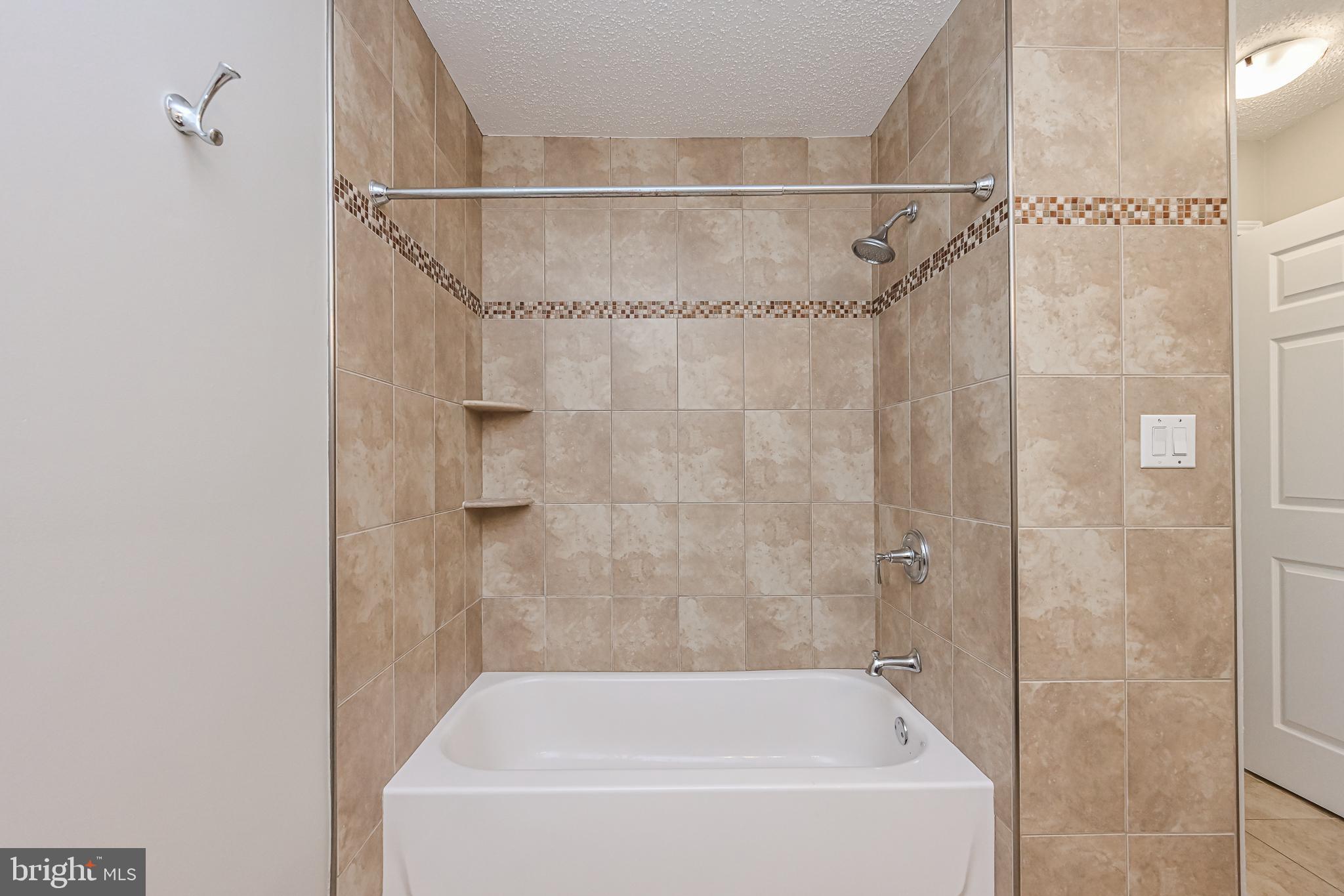 20952 Timber Ridge Terrace, Unit 103 Ashburn, VA 20147 - Photo 19 of 24 Tasteful ceramic tile in bathroom