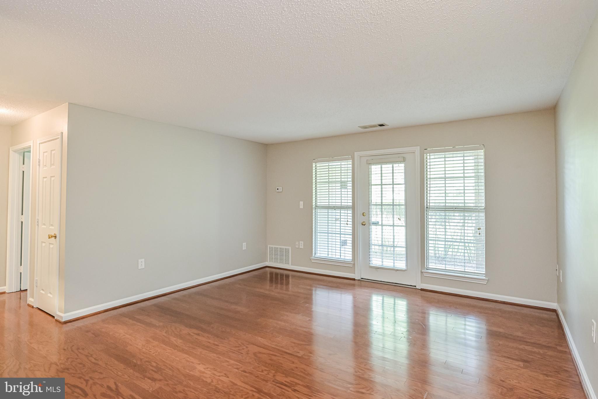 20952 Timber Ridge Terrace, Unit 103 Ashburn, VA 20147 - Photo 7 of 24 Fantastic hardwood floors for gentle flow thru out