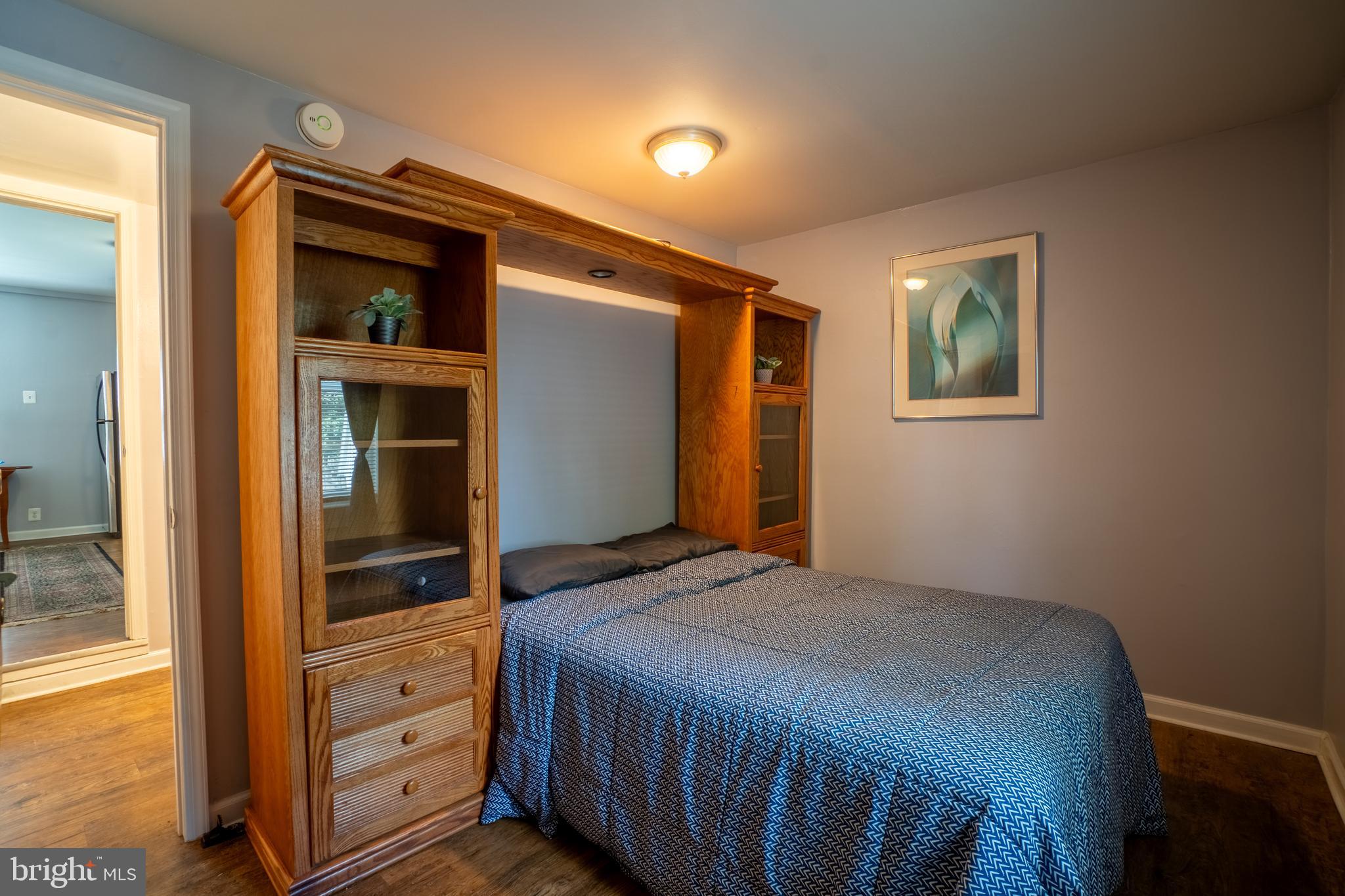 4415 Fairhaven Avenue Curtis Bay, MD 21226 - Photo 11 of 27 a bedroom with a bed and a dresser