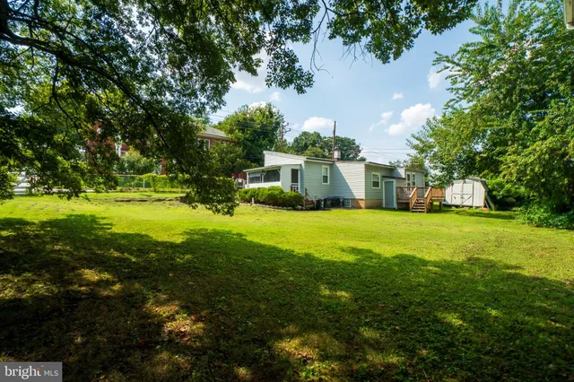 a view of a house with a big yard