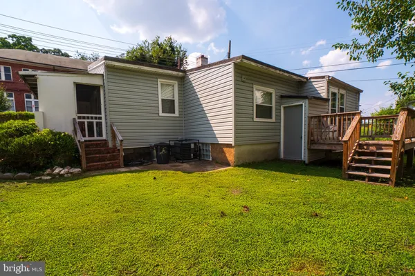 a view of a house with a yard and a garage