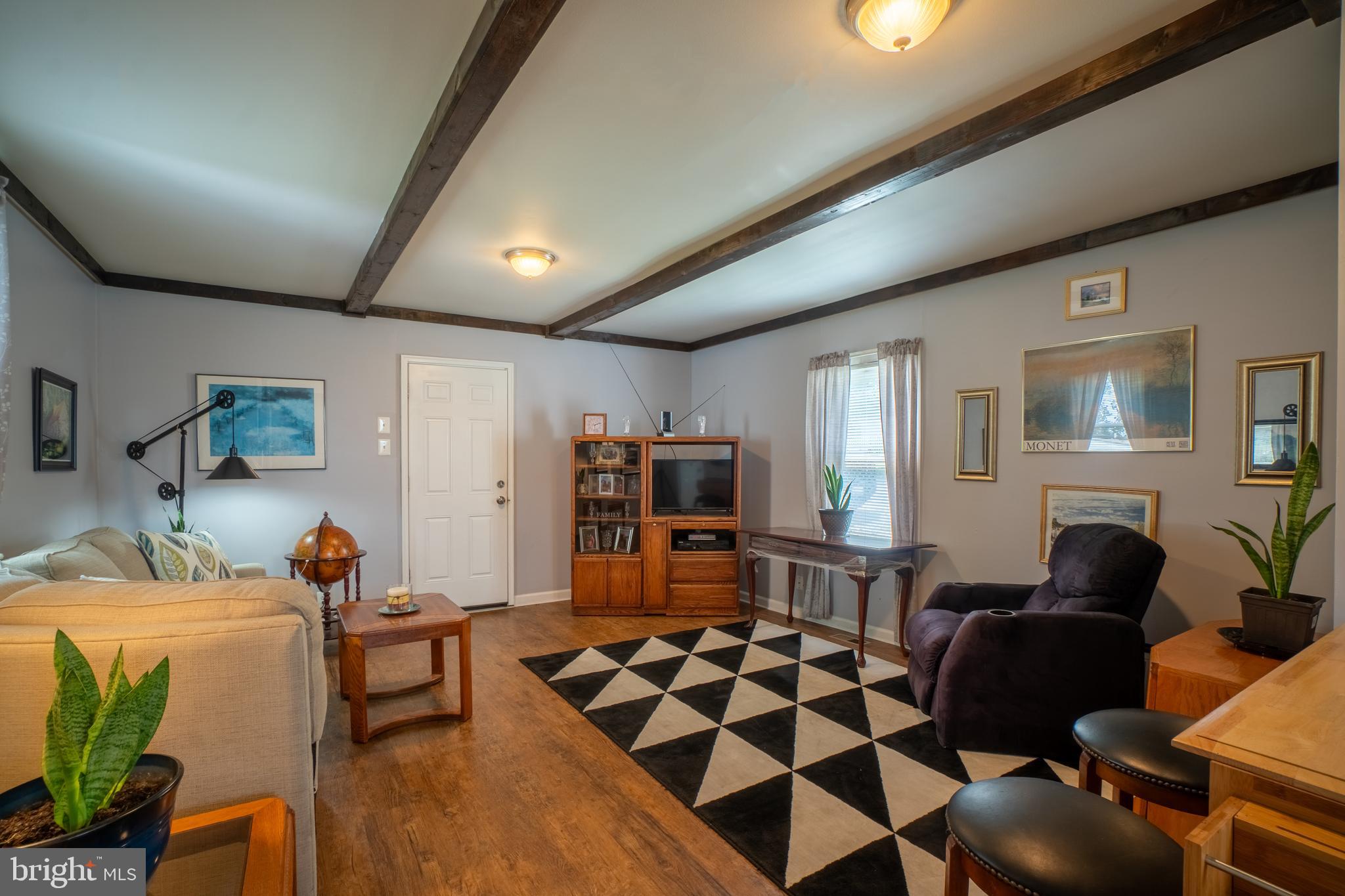 4415 Fairhaven Avenue Curtis Bay, MD 21226 - Photo 4 of 27 a living room with furniture and wooden floor