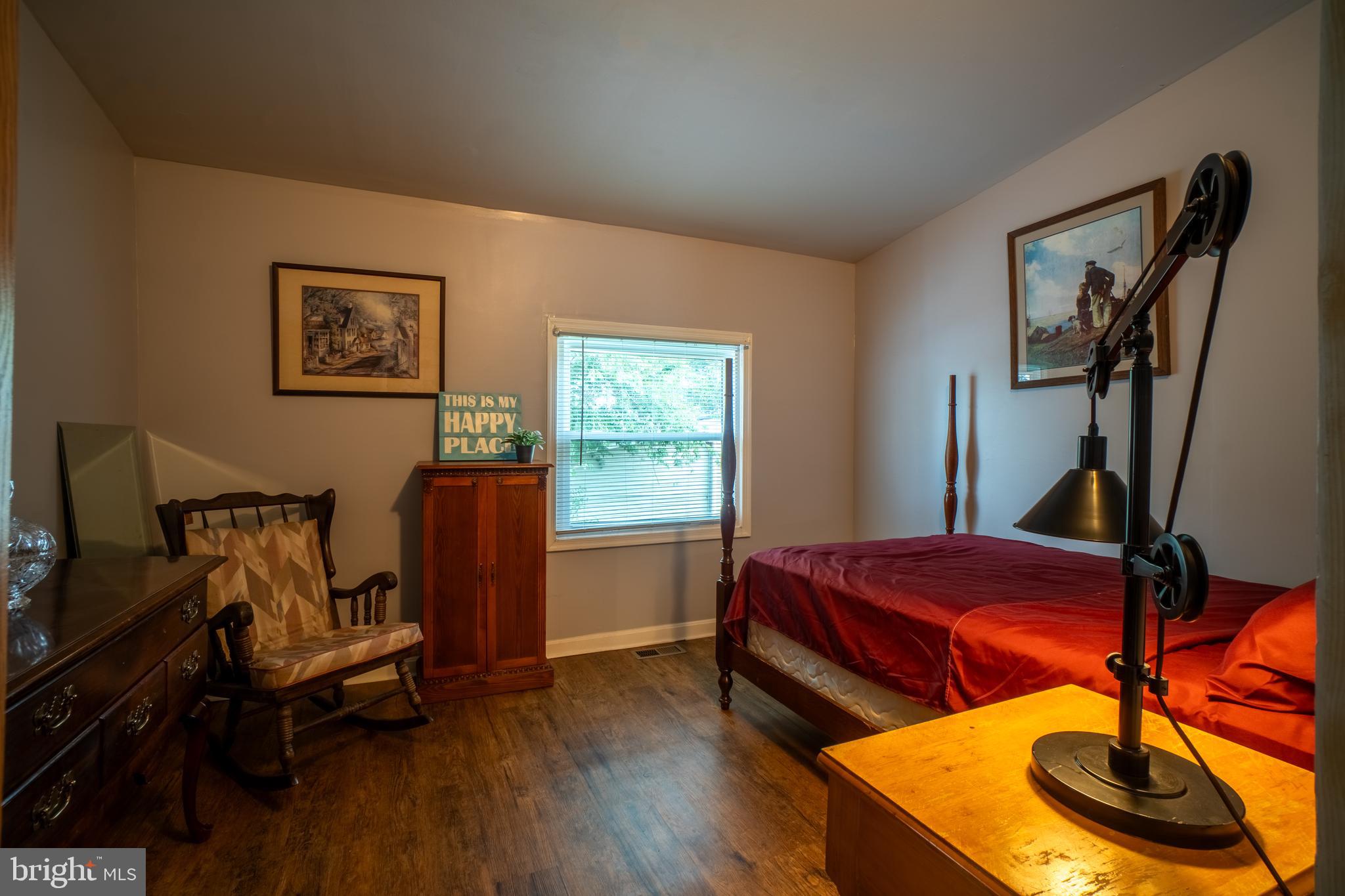 4415 Fairhaven Avenue Curtis Bay, MD 21226 - Photo 9 of 27 a bedroom with furniture and a wooden floor