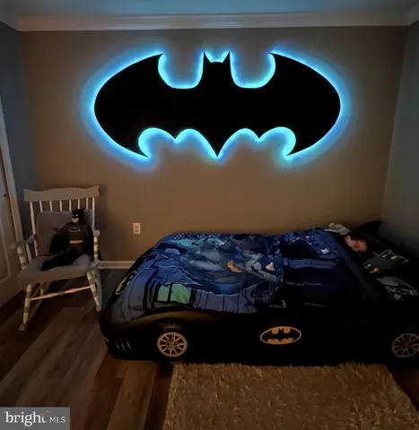 a table with chairs and wooden floor