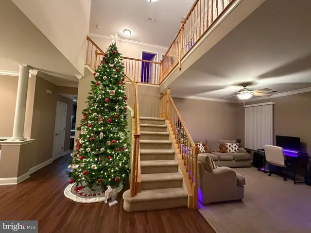 a living room with furniture and flowers