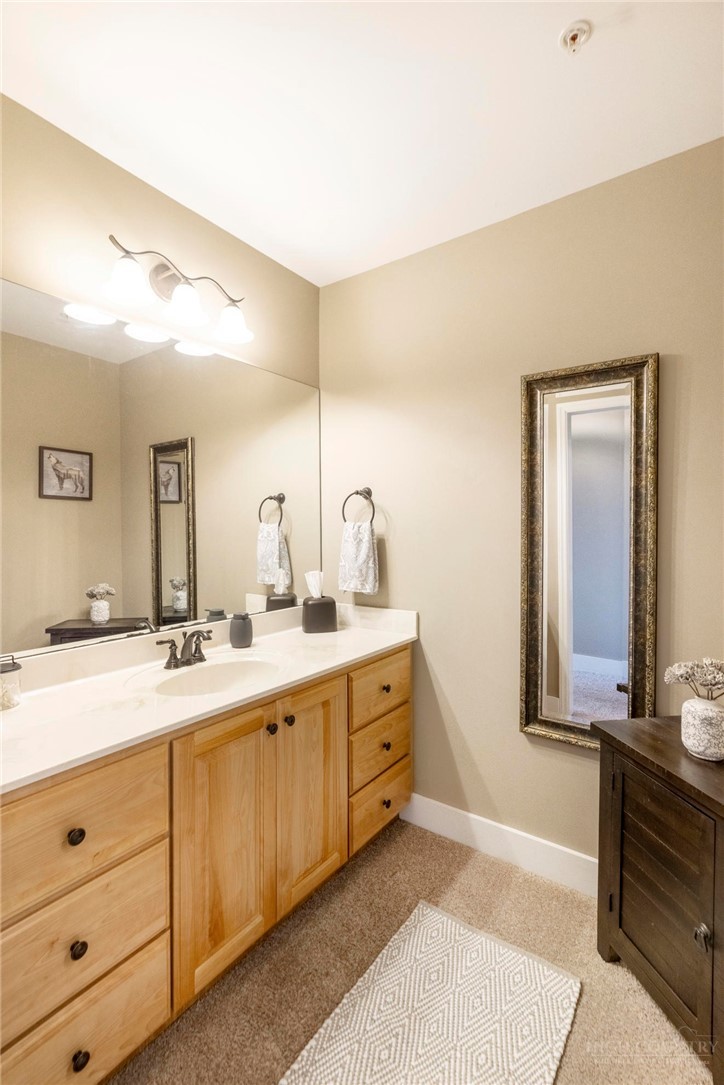942 Ridge Haven Parkway, Unit R1211 Banner Elk, NC 28604 - Photo 21 of 45 a spacious bathroom with a double vanity sink and a mirror