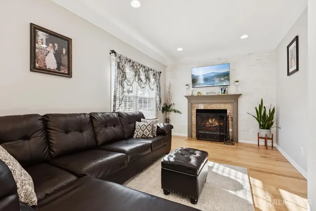 a living room with furniture and a fireplace