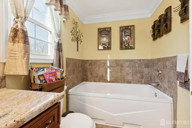 a bathroom with a bath tub and a sink