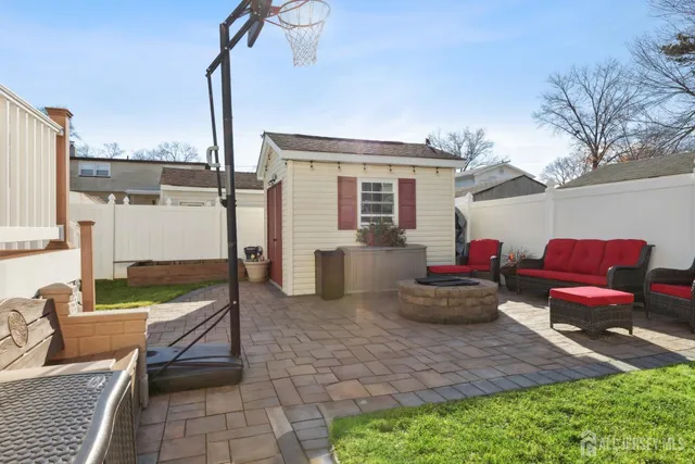 a front view of a house with outdoor seating