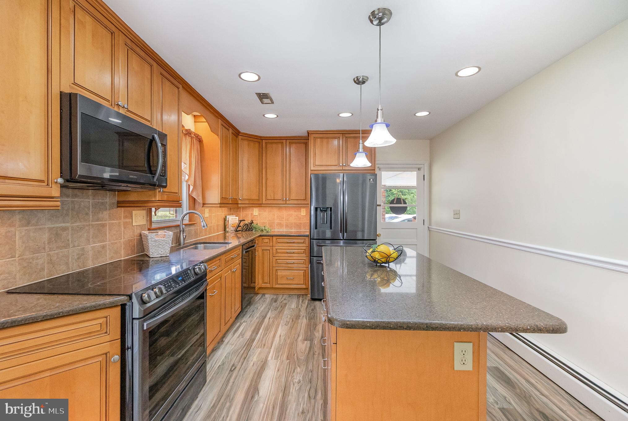 2120 Turkey Point Road Essex, MD 21221 - Photo 12 of 42 Center Island and updated cabinetry.