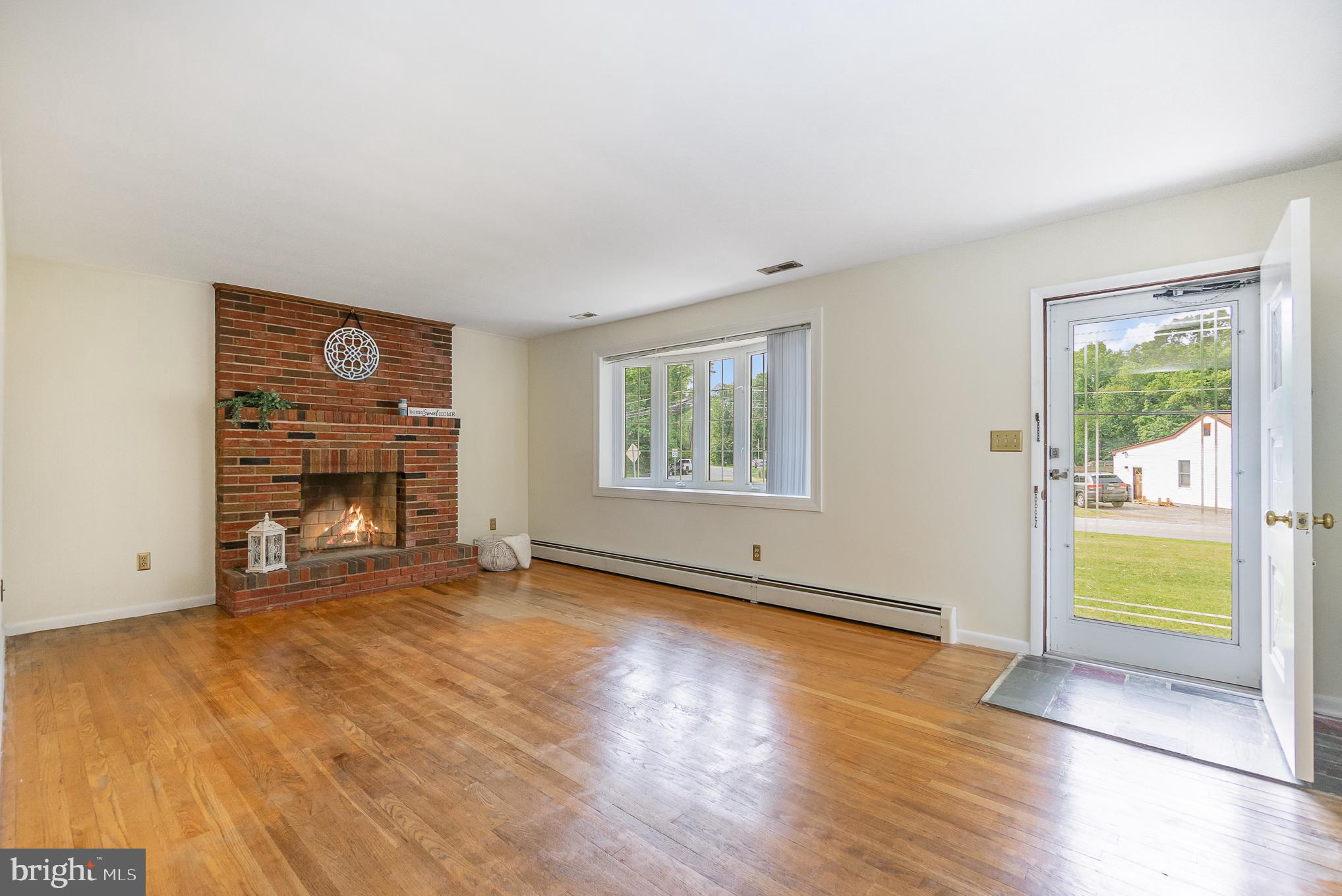 2120 Turkey Point Road Essex, MD 21221 - Photo 7 of 42 Fireplace & bay window in living room.