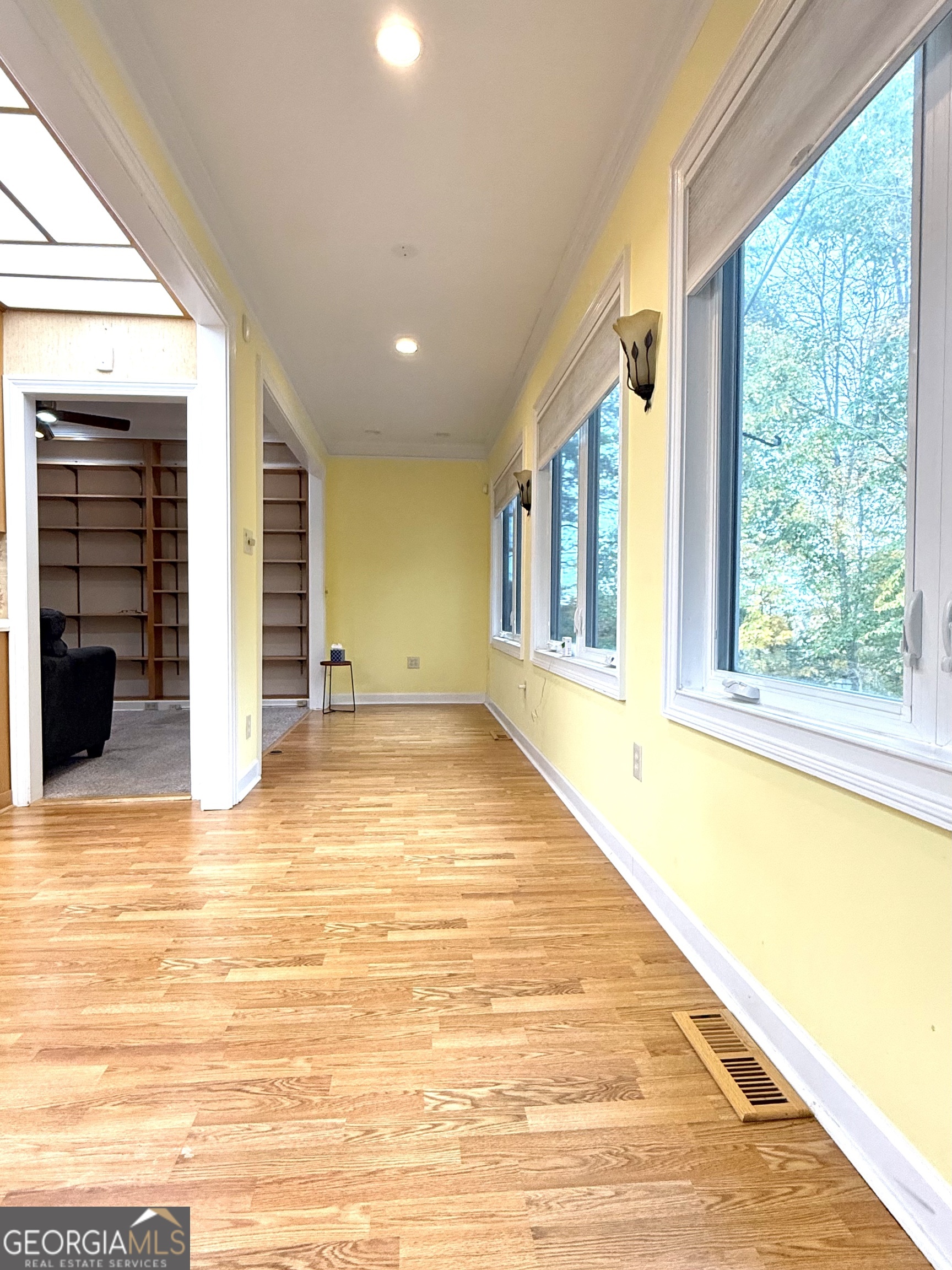 116 Paces Run Atlanta, GA 30339 - Photo 12 of 24 a view of an empty room with wooden floor and a window