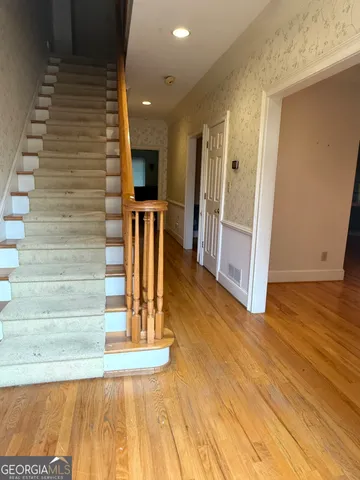 a view of entryway with wooden floor