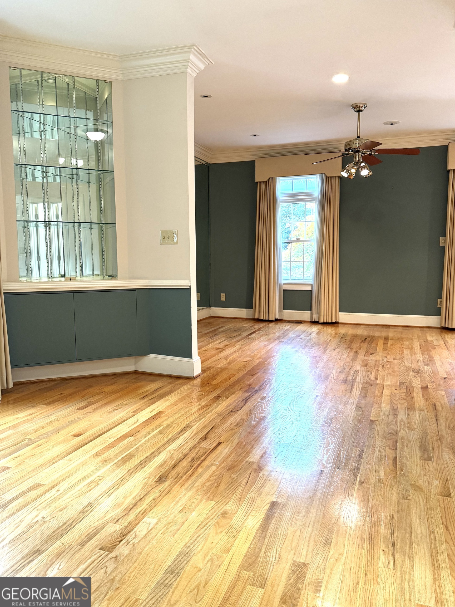 116 Paces Run Atlanta, GA 30339 - Photo 9 of 24 a view of an empty room with window and wooden floor