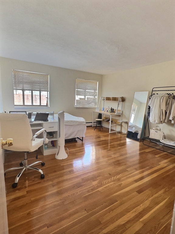 1027 Commonwealth Avenue, Unit 32 Boston, MA 02215 - Photo 5 of 8 a view of a living room filled with furniture