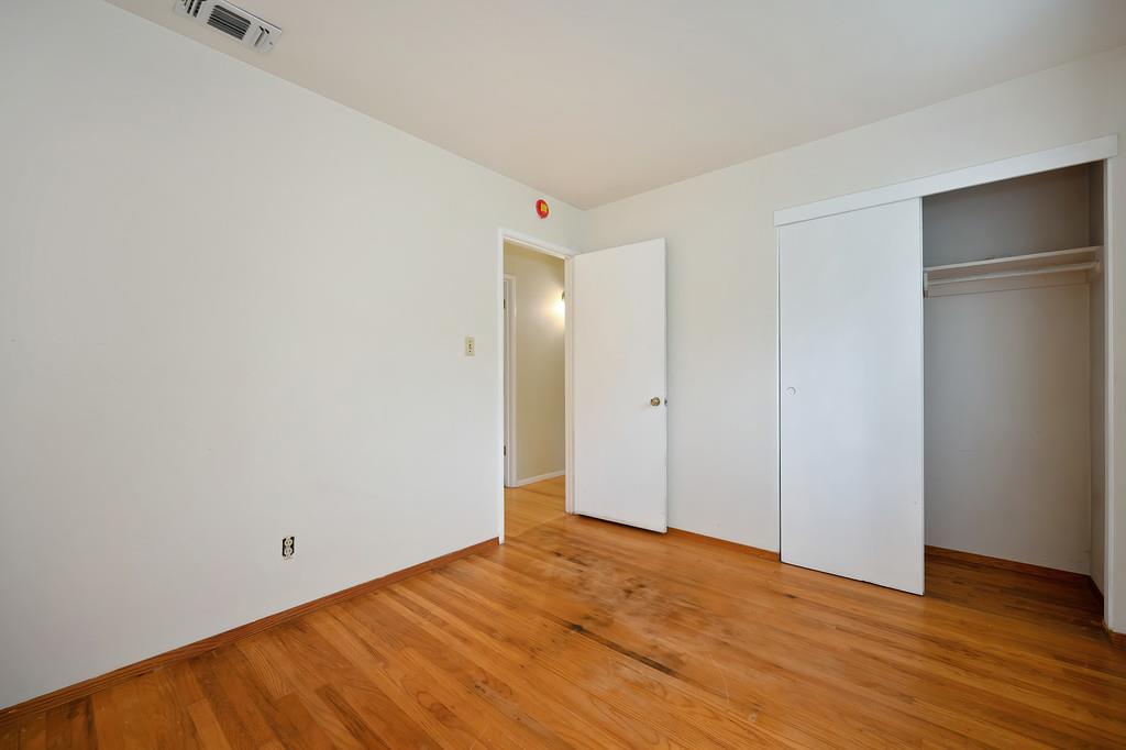 4606 Solano Way Fair Oaks, CA 95628 - Photo 21 of 40 a view of an empty room with wooden floor