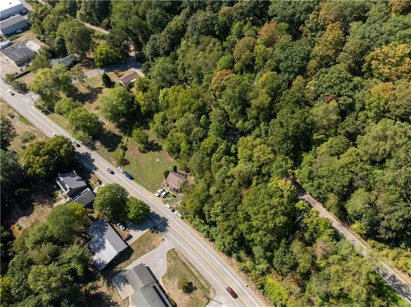 an aerial view of house with yard