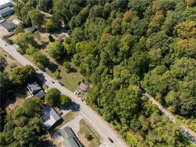 an aerial view of house with yard