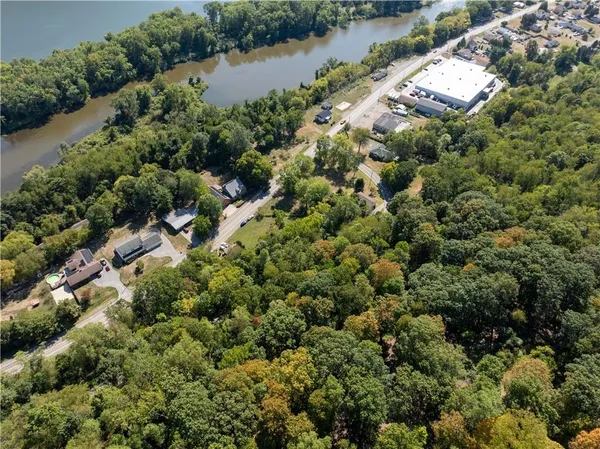 an aerial view of a houses with a lake view