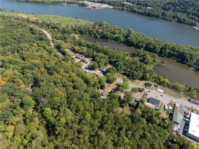 an aerial view of a houses with a lake view