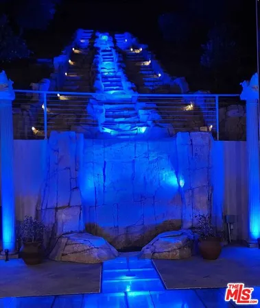 a view of a yard with couches and wooden floor