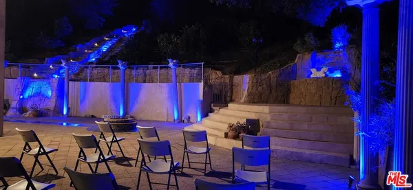 a view of a chairs and tables in patio