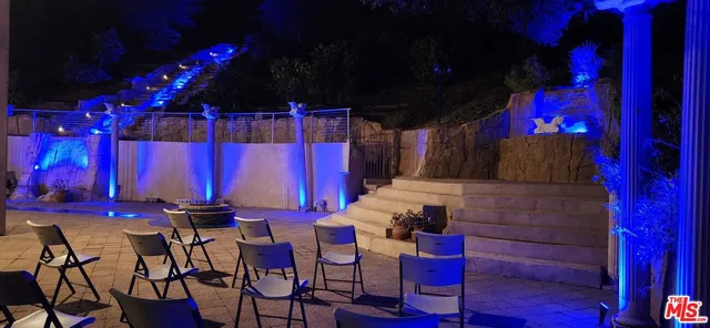 a view of a chairs and tables in patio