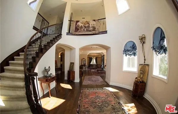 a view of hall way with furniture