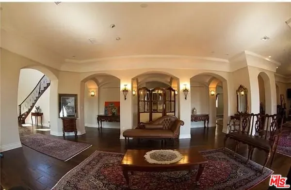 a living room with lots of furniture and a rug