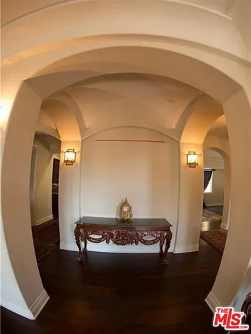 a living room with a table and chairs