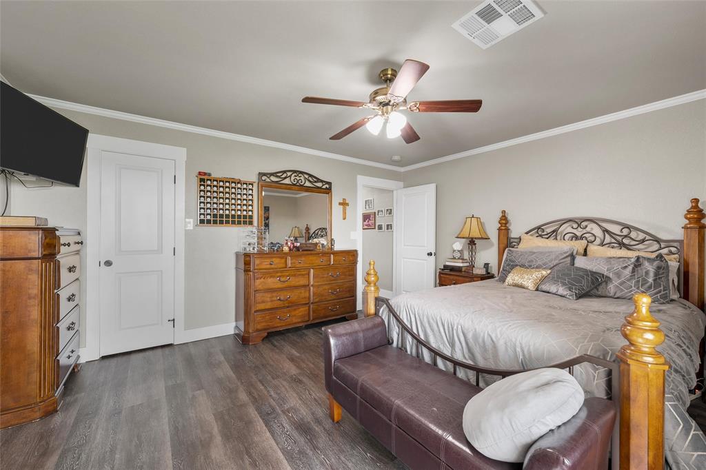 11541 Old Dallas Road West, TX 76691 - Photo 13 of 39 a bedroom with furniture and wooden floor