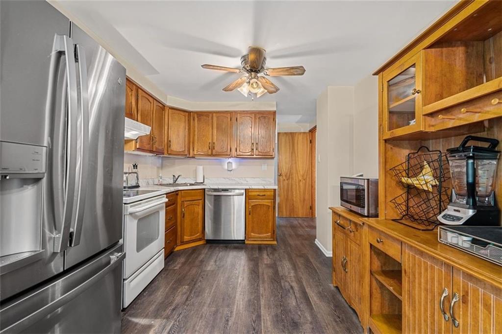 534 Dendron Drive Coraopolis, PA 15108 - Photo 12 of 33 a kitchen with a refrigerator a stove top oven a sink and dishwasher