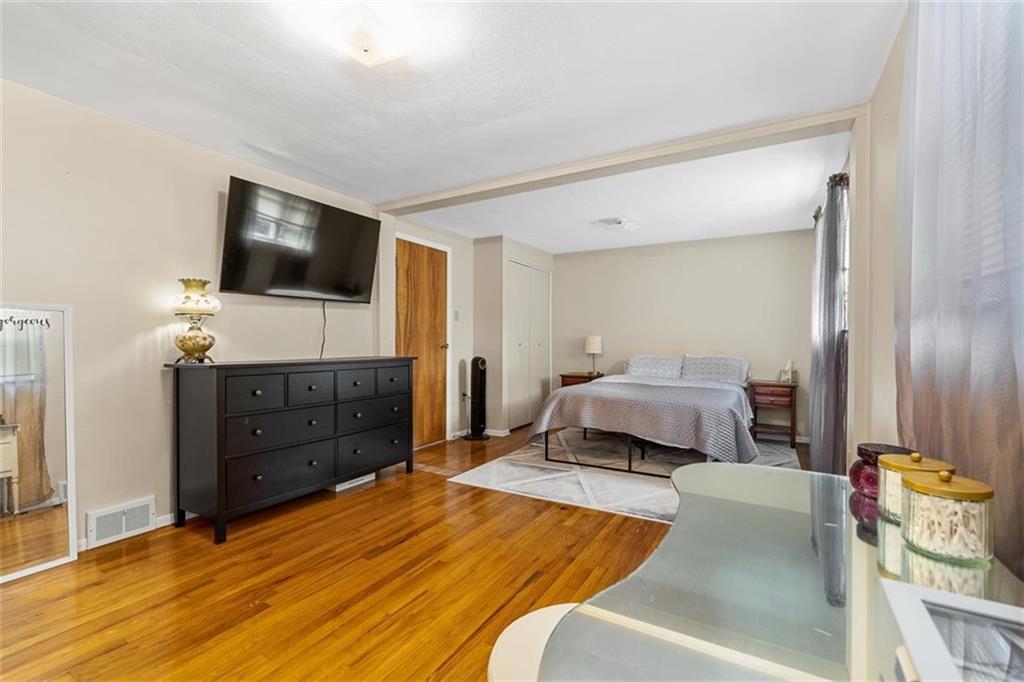 534 Dendron Drive Coraopolis, PA 15108 - Photo 19 of 33 a bedroom with a bed and a flat screen television