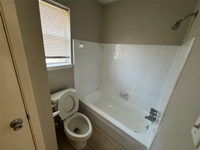 a bathroom with a sink a toilet and a bathtub