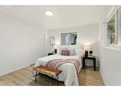 a bedroom with a bed and a table