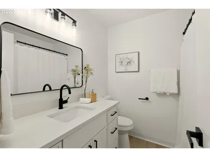 a bathroom with a sink and mirror