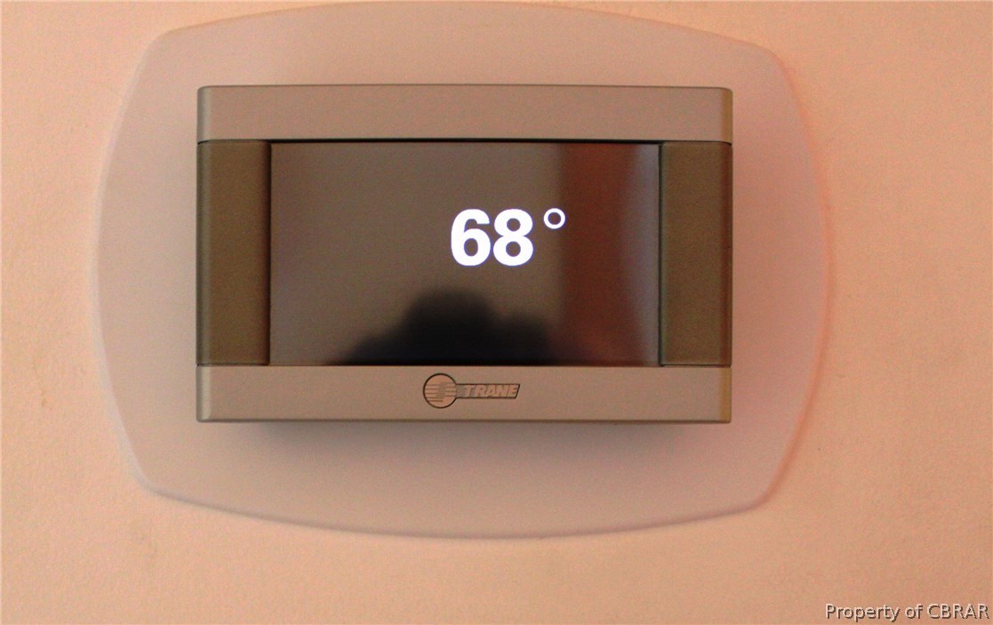 7449 Joseph Lewis Road Hayes, VA 23072 - Photo 20 of 32 New digital thermostat installed with new Trane HVAC 6/15 and is located in the hallway to the bedrooms.
