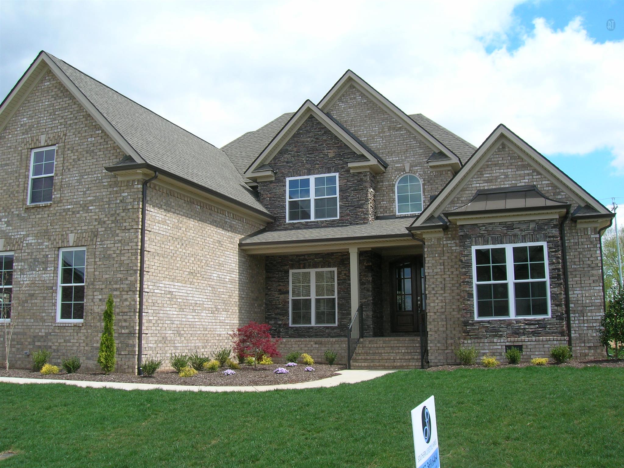 1 Williams Road Christiana, TN 37037 - Photo 1 of 1 a front view of a house with a garden and plants